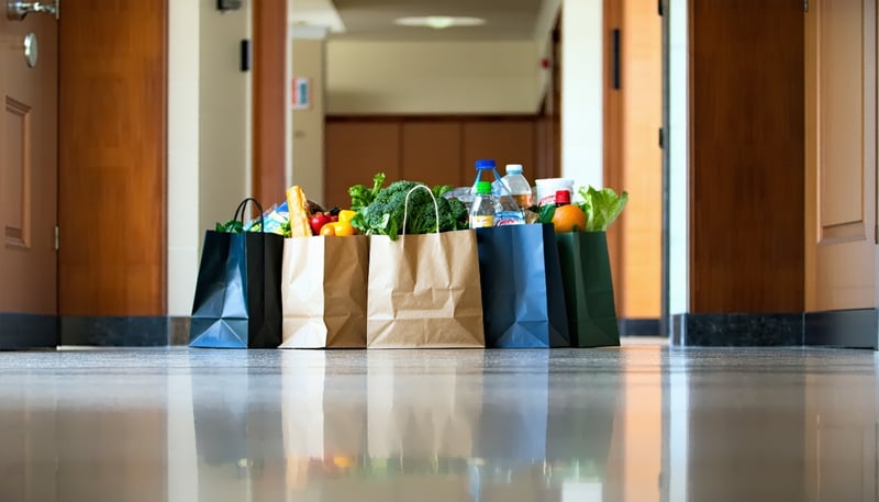Grocery delivery bags in a condominium hallway